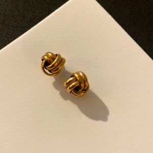 Gold knot earrings.